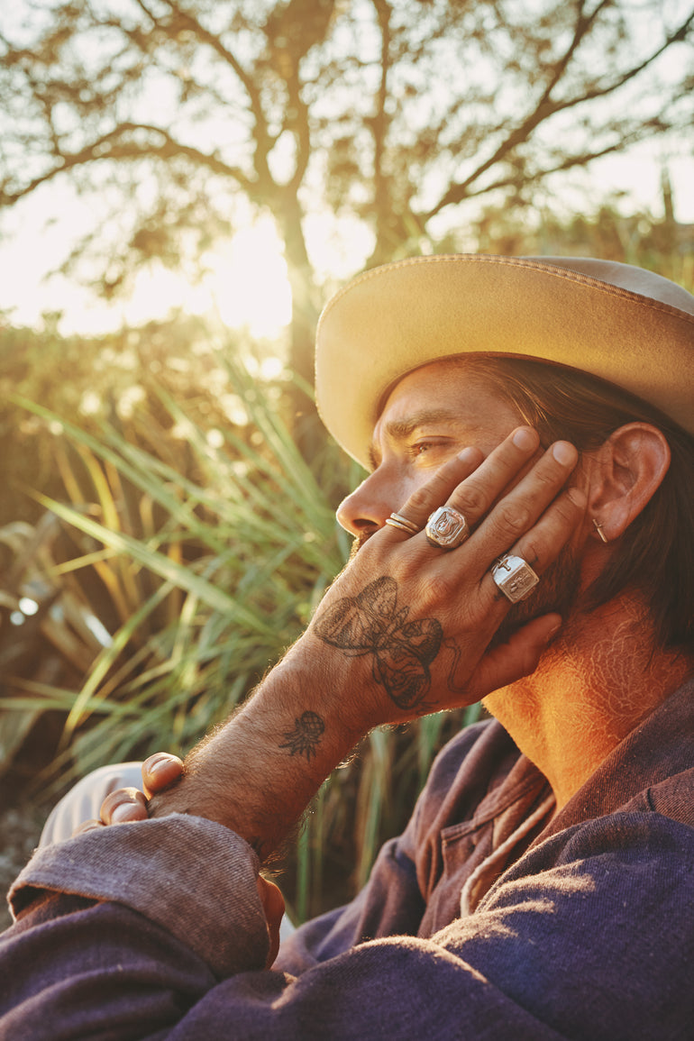 image of male model featuring sterling silver souvenir biker rings, lifestyle photo