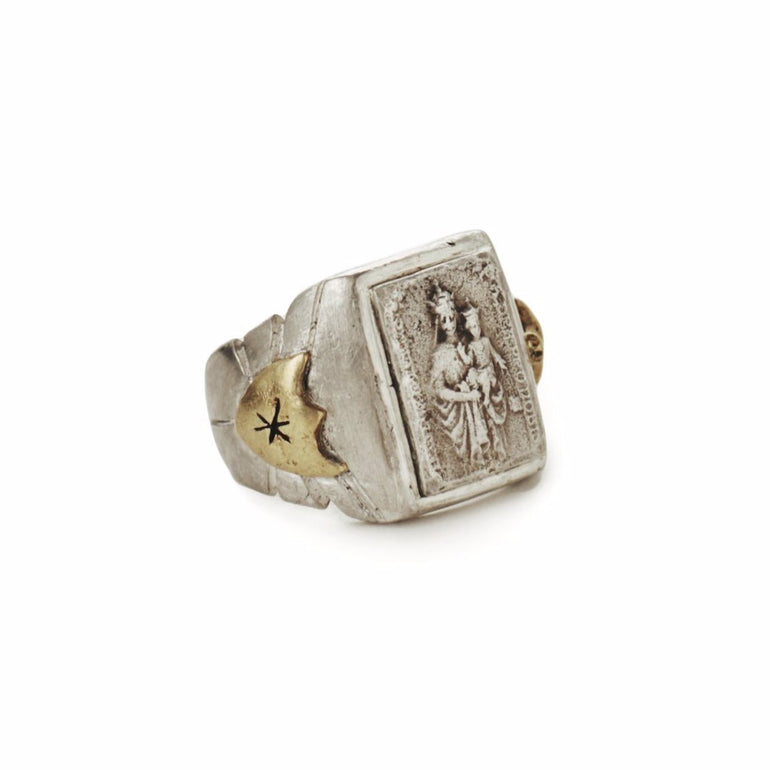 image of sterling silver souvenir biker ring with mother Mary holding baby Jesus, with brass sword and shield crest, side view