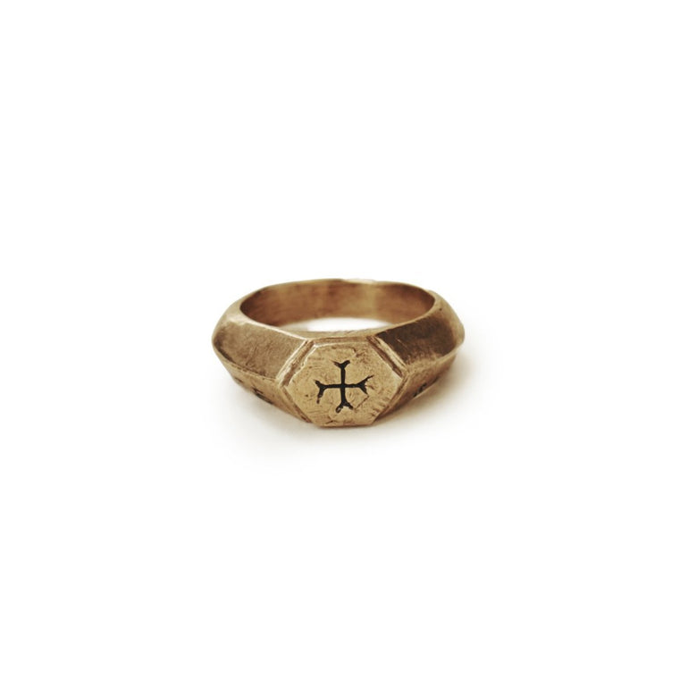 image of bronze Sumerian cross ring with Latin words Sacrum Caritate for Sacred Love, front view