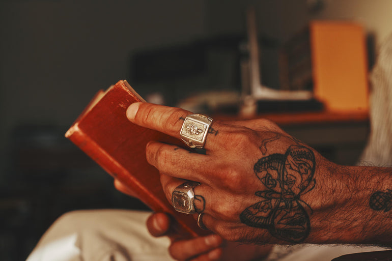 image of male model's hand featuring sterling silver souvenir biker ring, Reverent ring with Jesus and Mother Mary