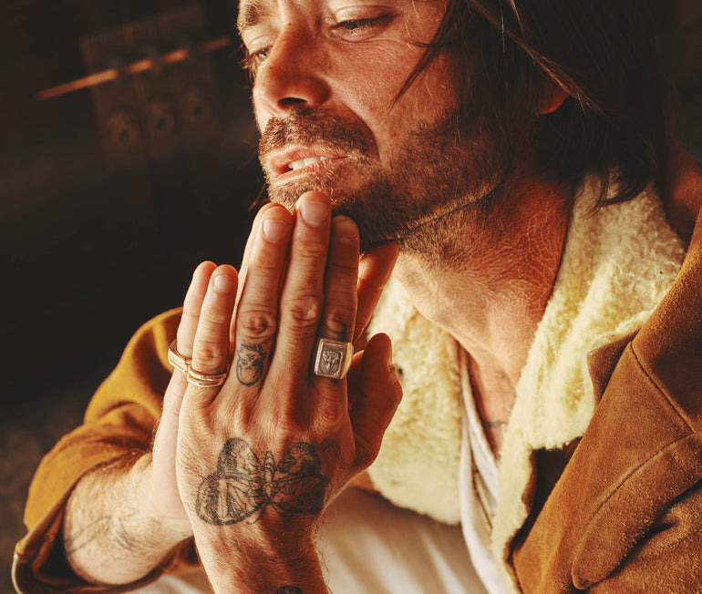 image of Jesus Savior on sterling silver Souvenir biker ring worn on male model